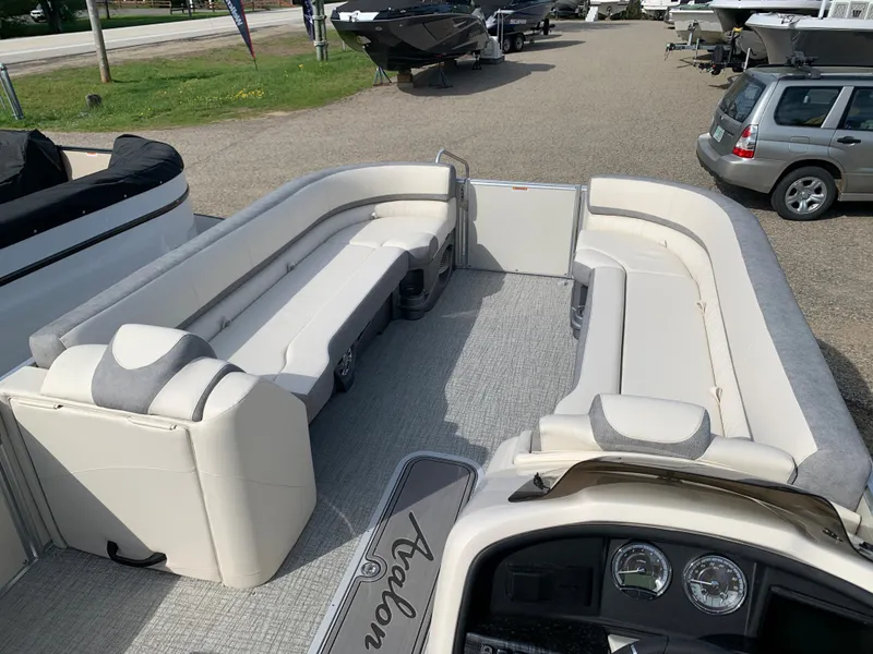 Slide: The Image of 2023 Avalon Catalina VRL 25' Tri-Toon boat interior with spacious seating and modern dashboard. - 13