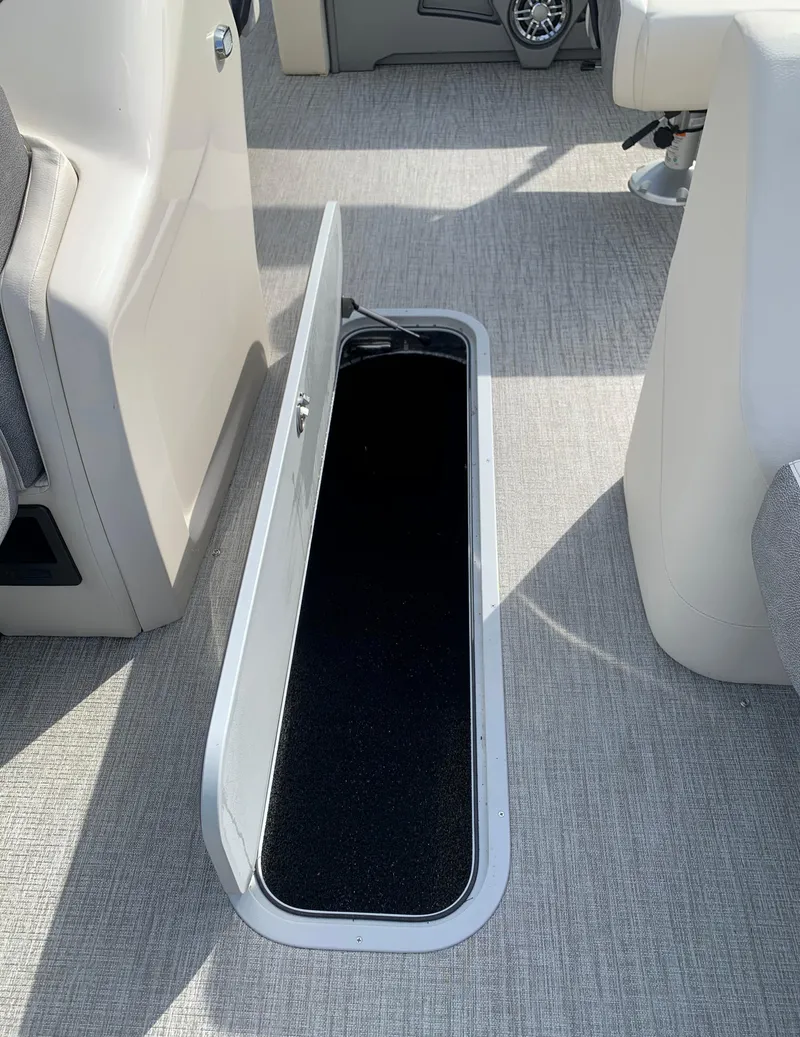 Slide: The Image of 2023 Avalon Catalina VRL 25' Tri-Toon interior storage compartment. - 30