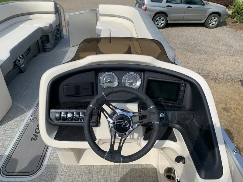 Slide: The Image of 2023 Avalon Catalina VRL 25' Tri-Toon boat dashboard with steering wheel and gauges. - 32