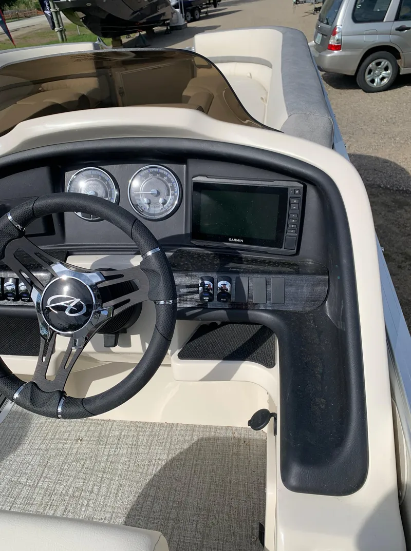 Slide: The Image of 2023 Avalon Catalina VRL 25' Tri-Toon boat dashboard and steering wheel. - 34