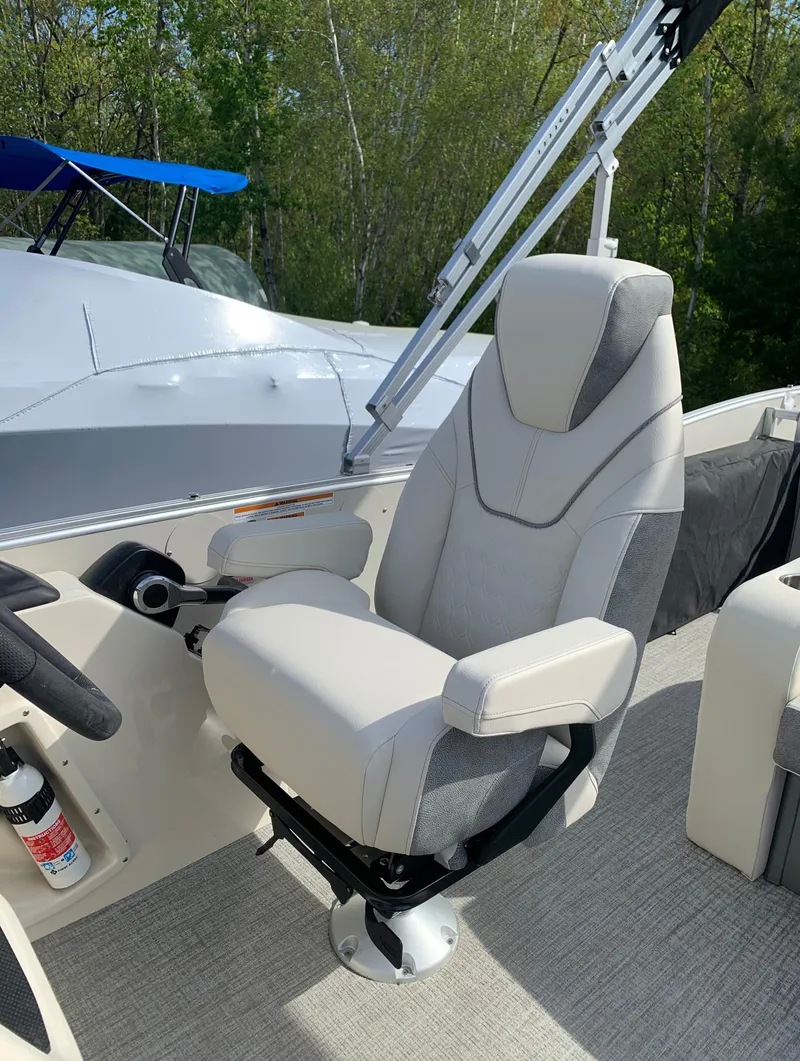 Slide: The Image of 2023 Avalon Catalina VRL 25' Tri-Toon captain's chair with armrests and modern design. - 36