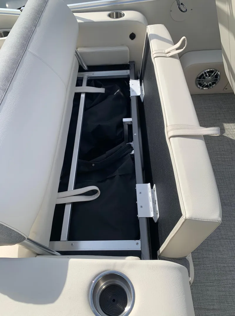 Slide: The Image of 2023 Avalon Catalina VRL 25' Tri-Toon boat with open storage compartment under seat. - 41