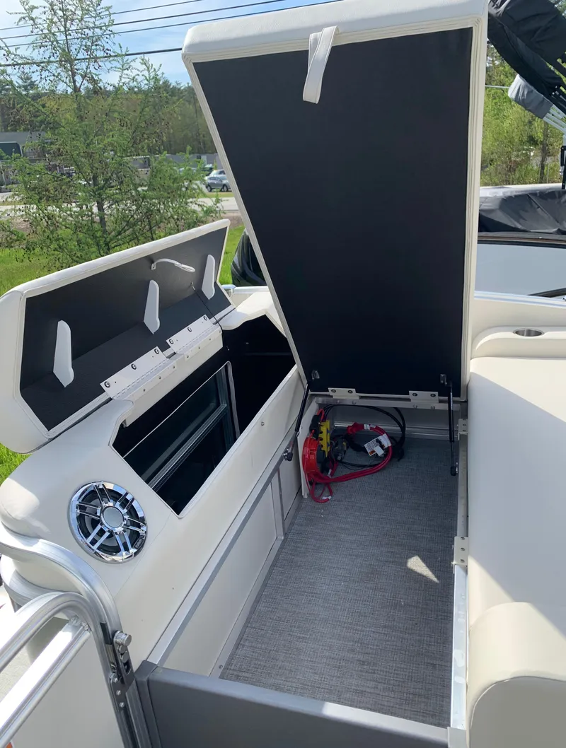 Slide: The Image of 2023 Avalon Catalina VRL 25' Tri-Toon storage compartment with open lid. - 44