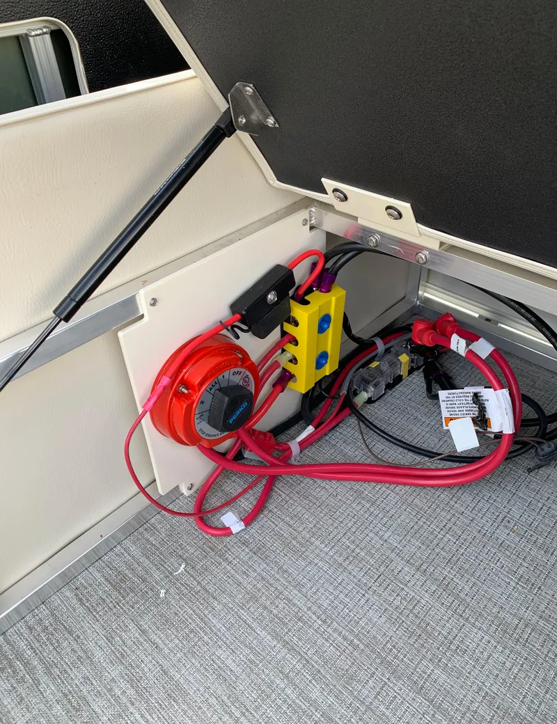 Slide: The Image of Electrical wiring and components inside a 2023 Avalon Catalina VRL 25' Tri-Toon boat. - 45