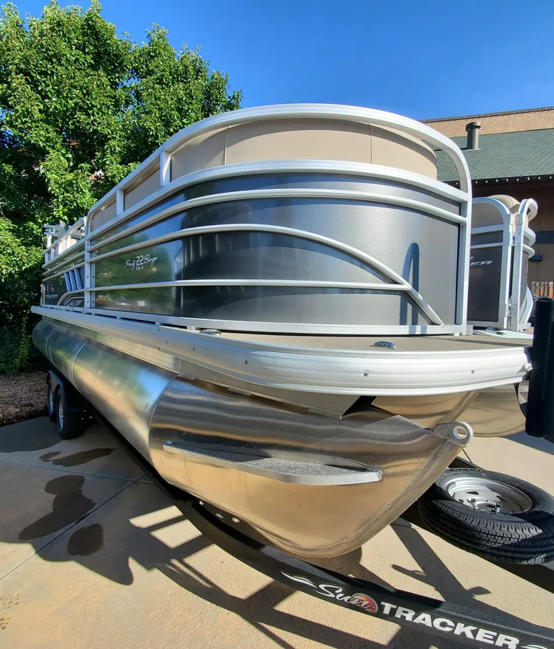 The Image of 2023 Sun Tracker Party Barge 22 XP3 pontoon boat on trailer. - 0