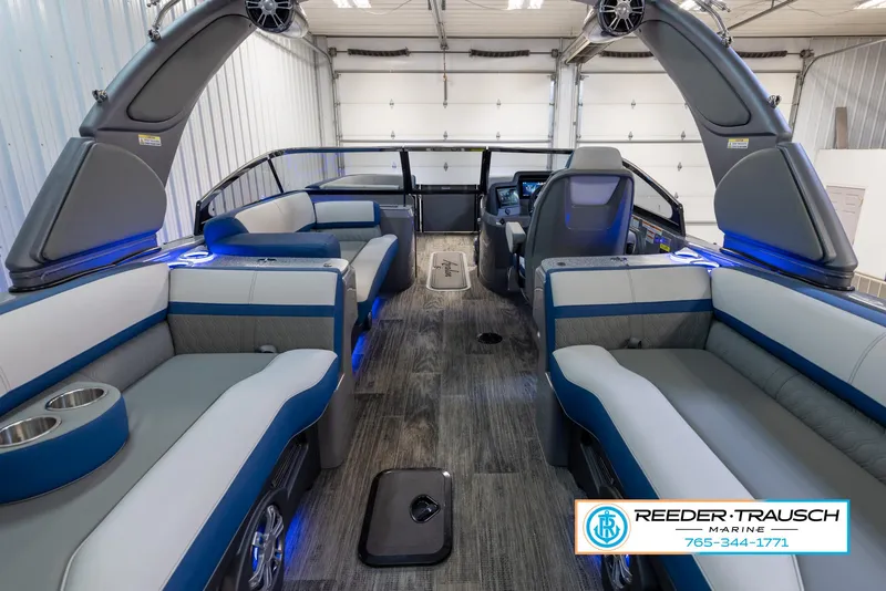 Slide: The Image of 2023 Avalon Waketoon interior with blue LED lighting and luxury seating. - 11