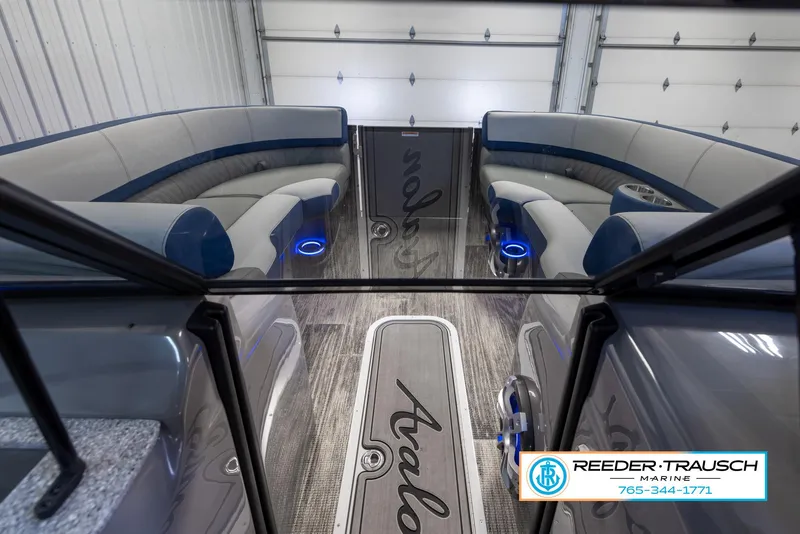 Slide: The Image of 2023 Avalon Waketoon interior with blue LED lighting and Reeder-Trausch Marine branding. - 20