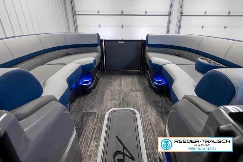 Slide: The Image of 2023 Avalon Waketoon interior with blue LED lighting and plush seating. - 21
