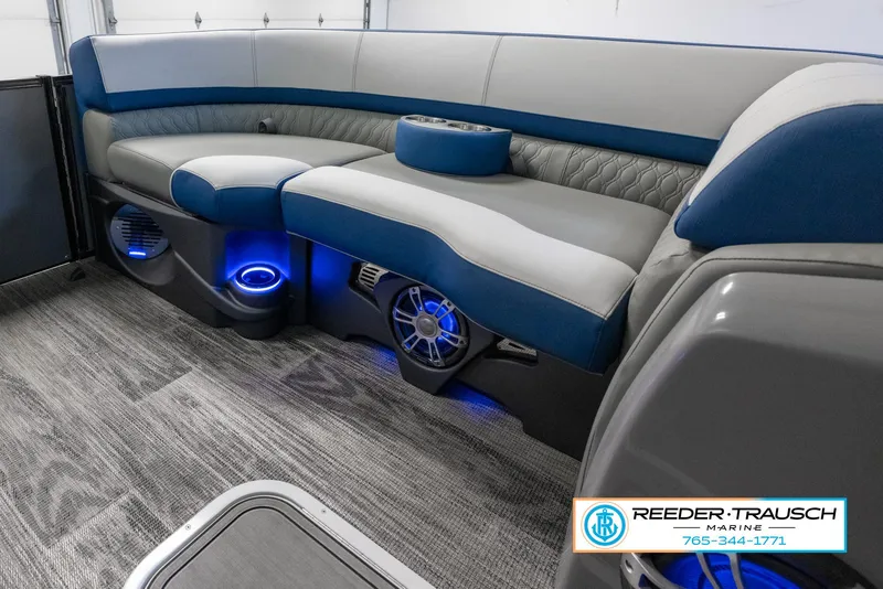 Slide: The Image of 2023 Avalon Waketoon interior with blue LED lighting and plush seating. - 22