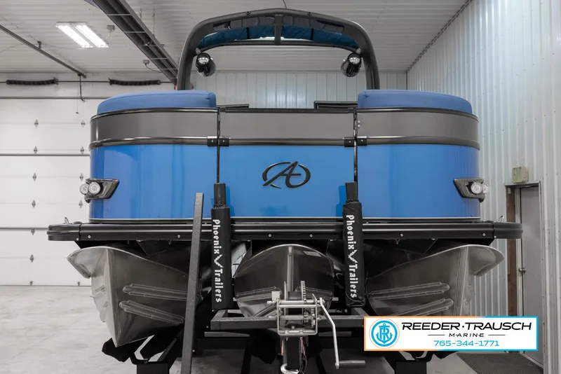 Slide: The Image of 2023 Avalon Waketoon boat in a garage, displayed by Reeder Trausch Marine. - 3