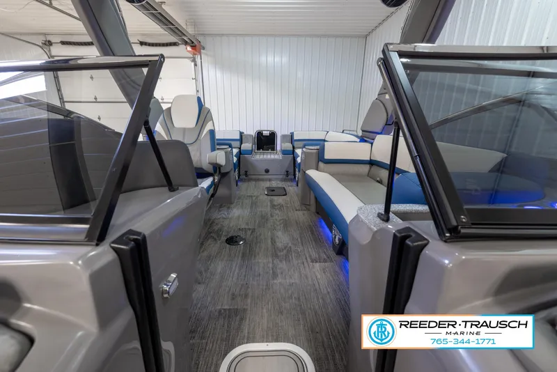 Slide: The Image of 2023 Avalon Waketoon interior with seating and console, showcased by Reeder Trausch Marine. - 30