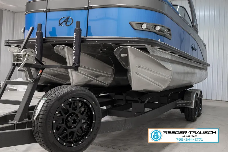 Slide: The Image of 2023 Avalon Waketoon boat on trailer at Reeder Trausch Marine. - 4