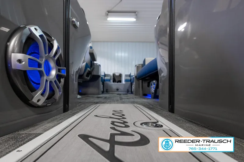 Slide: The Image of 2023 Avalon Waketoon interior with blue LED speakers, Reeder-Trausch Marine logo. - 48