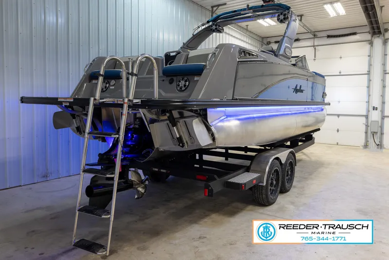 Slide: The Image of 2023 Avalon Waketoon boat on trailer in indoor storage facility. - 7