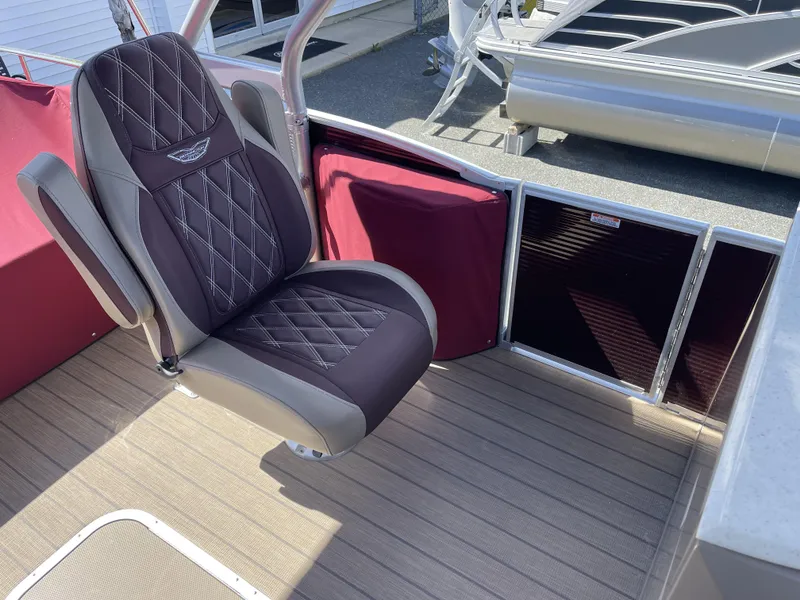 Slide: The Image of 2021 Bennington 24 RTSBA DLX boat seat with diamond-stitched upholstery and armrests. - 10