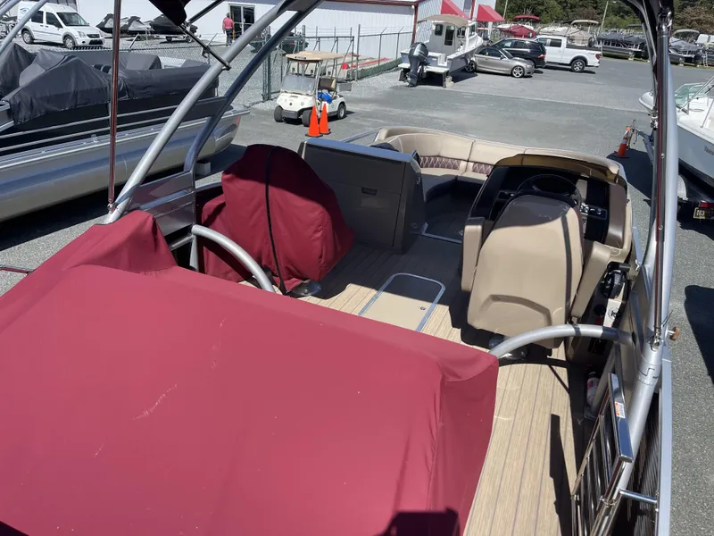 Slide: The Image of 2021 Bennington 24 RTSBA DLX Fold Open SP Arch (Gas Assist) pontoon boat interior with red covers. - 5