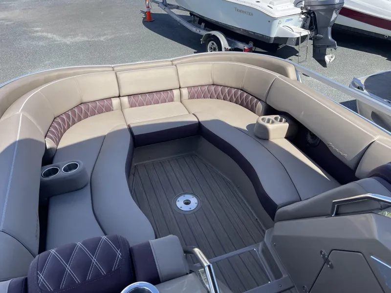Slide: The Image of 2021 Bennington 24 RTSBA DLX pontoon boat with spacious seating and cup holders. - 8