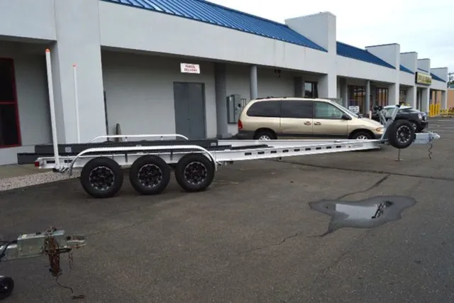 Slide: The Image of Venture Trailers Aluminum Triple Axle Commander Series COM-10800 2024 - 2