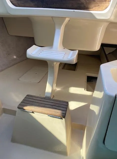 Slide: The Image of 1993 Hunter 23.5 sailboat interior with steps and seating area. - 10