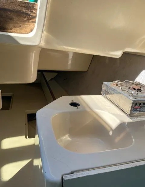 Slide: The Image of Interior of a 1993 Hunter 23.5 sailboat with sink and stove. - 12