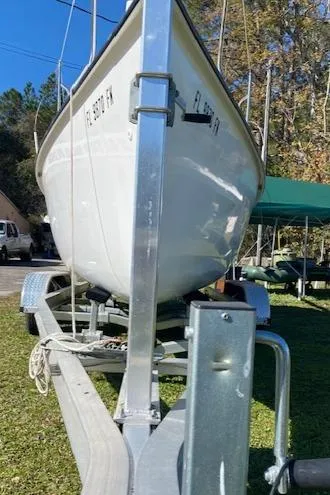 Slide: The Image of 1993 Hunter 23.5 sailboat on a trailer, parked on grass. - 15