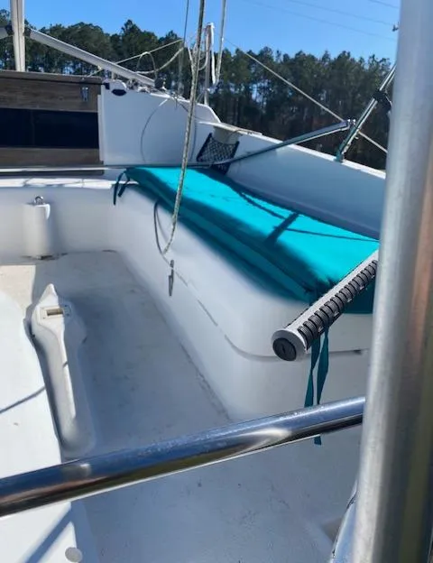 Slide: The Image of 1993 Hunter 23.5 sailboat cockpit with teal cushions and rigging. - 3