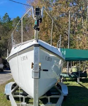 Slide: The Image of 1993 Hunter 23.5 sailboat on a trailer in a yard. - 5
