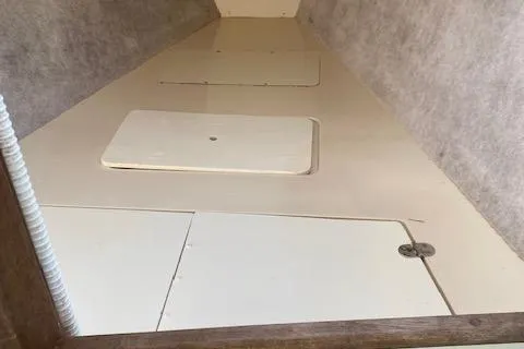 Slide: The Image of Interior storage compartments of a 1993 Hunter 23.5 sailboat. - 9