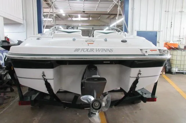 Slide: The Image of 2007 Four Winns 220 Horizon boat in a garage, rear view. - 3