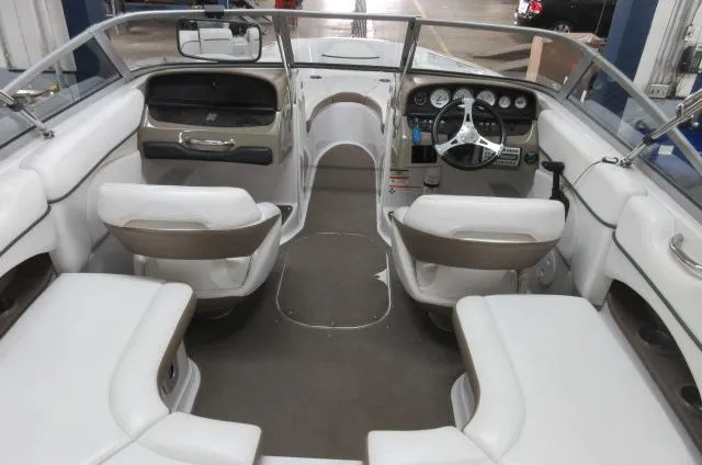 Slide: The Image of 2007 Four Winns 220 Horizon boat interior with white and beige seating. - 4