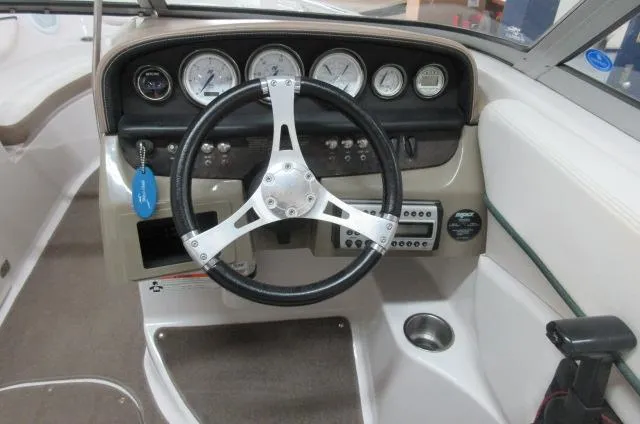 Slide: The Image of 2007 Four Winns 220 Horizon boat dashboard with steering wheel and gauges. - 5