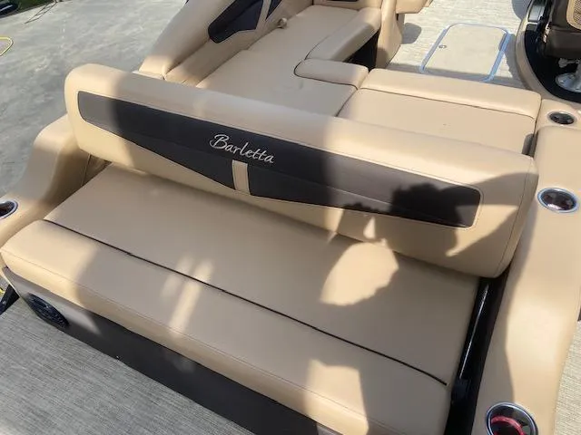 Slide: The Image of 2023 Barletta Cabrio C22U boat with beige and black seating. - 10