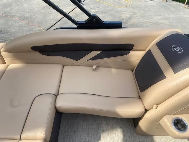Slide: The Image of 2023 Barletta Cabrio C22U boat interior with beige and black seating. - 11