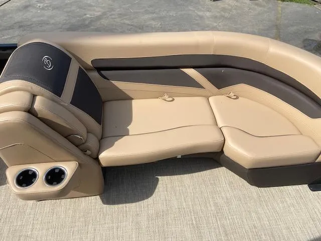 Slide: The Image of 2023 Barletta Cabrio C22U boat interior with beige and black seating. - 16