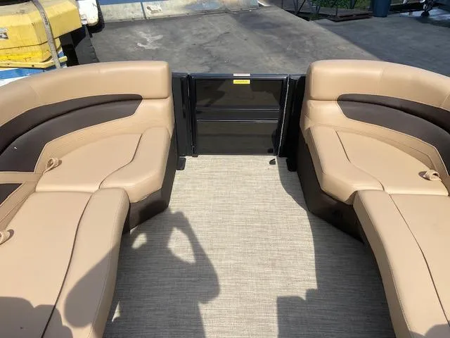 Slide: The Image of 2023 Barletta Cabrio C22U boat interior with tan and brown seating. - 18