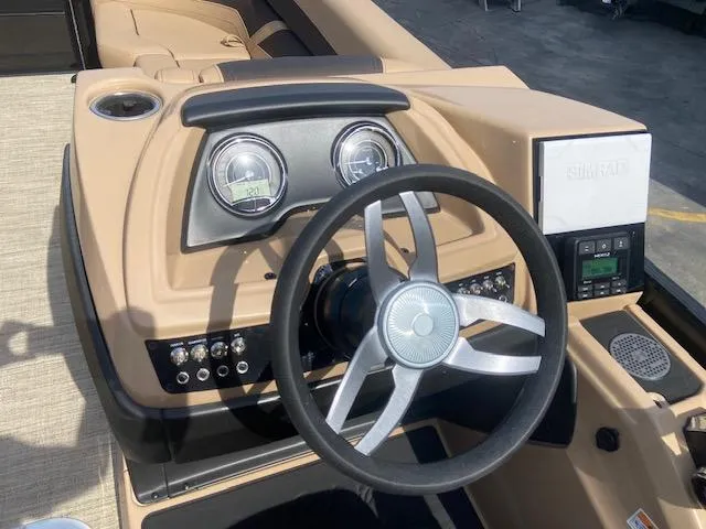 Slide: The Image of 2023 Barletta Cabrio C22U boat dashboard with steering wheel and control panel. - 19