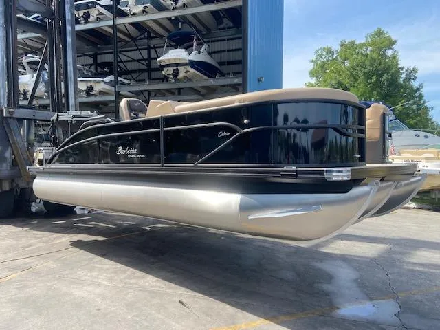 Slide: The Image of 2023 Barletta Cabrio C22U pontoon boat in storage facility. - 3