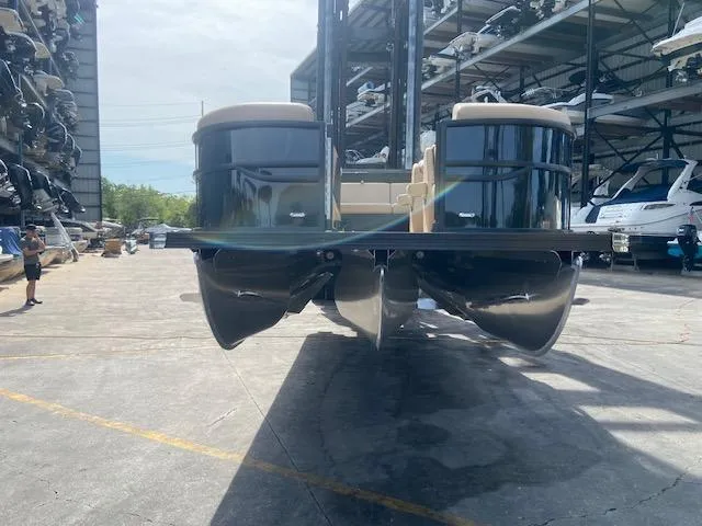 Slide: The Image of 2023 Barletta Cabrio C22U pontoon boat in a storage facility. - 4