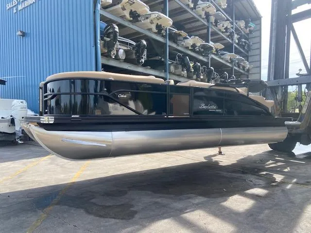 Slide: The Image of 2023 Barletta Cabrio C22U pontoon boat at a marina storage facility. - 5