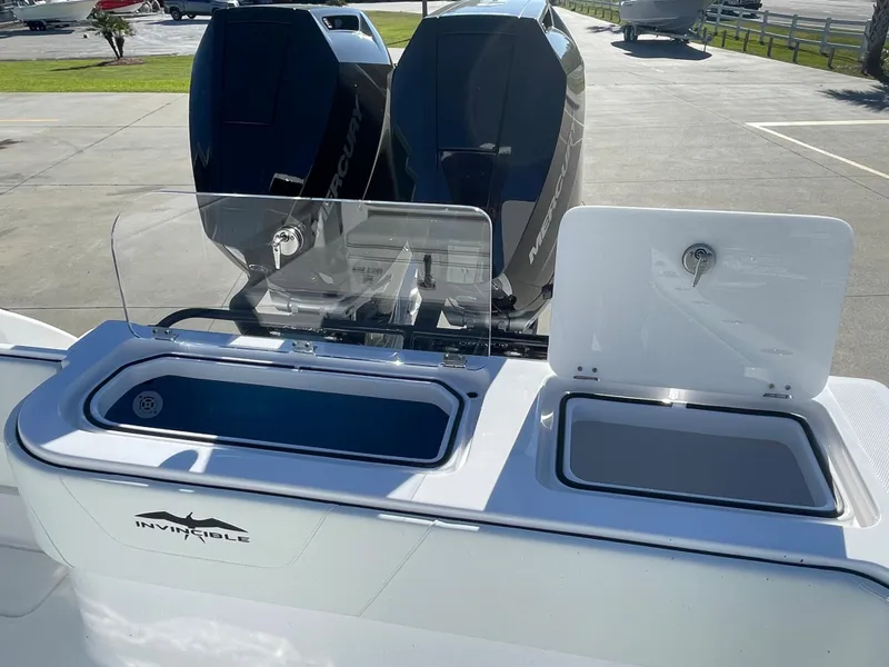 Slide: The Image of 2024 Invincible 33 Open Fisherman boat with dual outboard engines. - 15