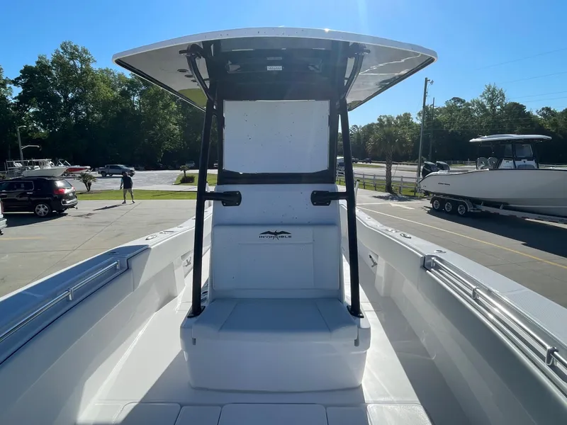 Slide: The Image of 2024 Invincible 33 Open Fisherman boat, front view at a dealership. - 23