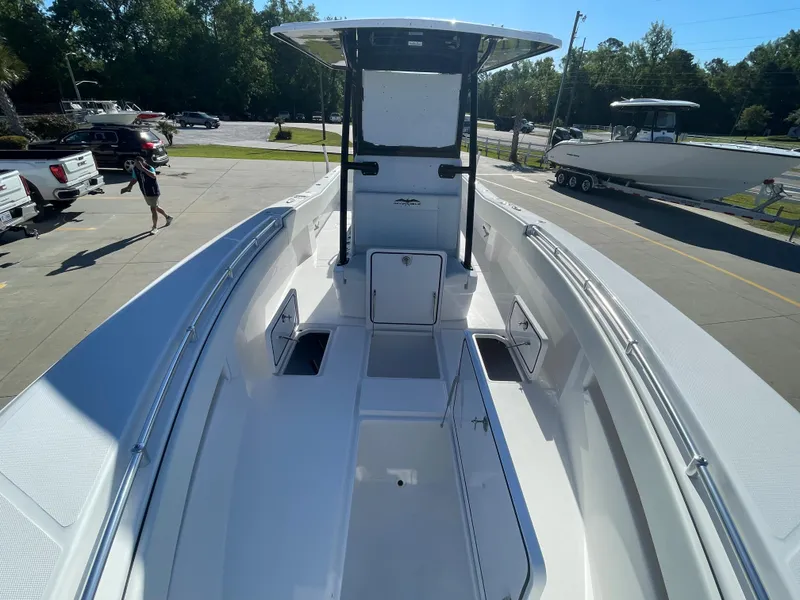 Slide: The Image of 2024 Invincible 33 Open Fisherman boat, front deck view, parked outdoors. - 27