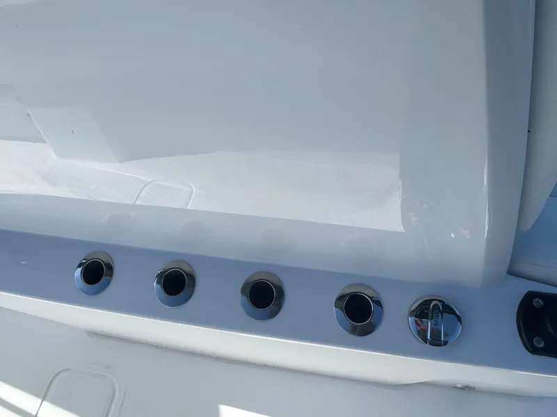 Slide: The Image of Close-up of rod holders on a 2024 Invincible 33 Open Fisherman boat. - 29
