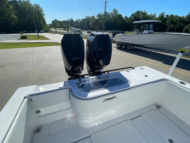 Slide: The Image of 2024 Invincible 33 Open Fisherman boat with dual outboard engines. - 8