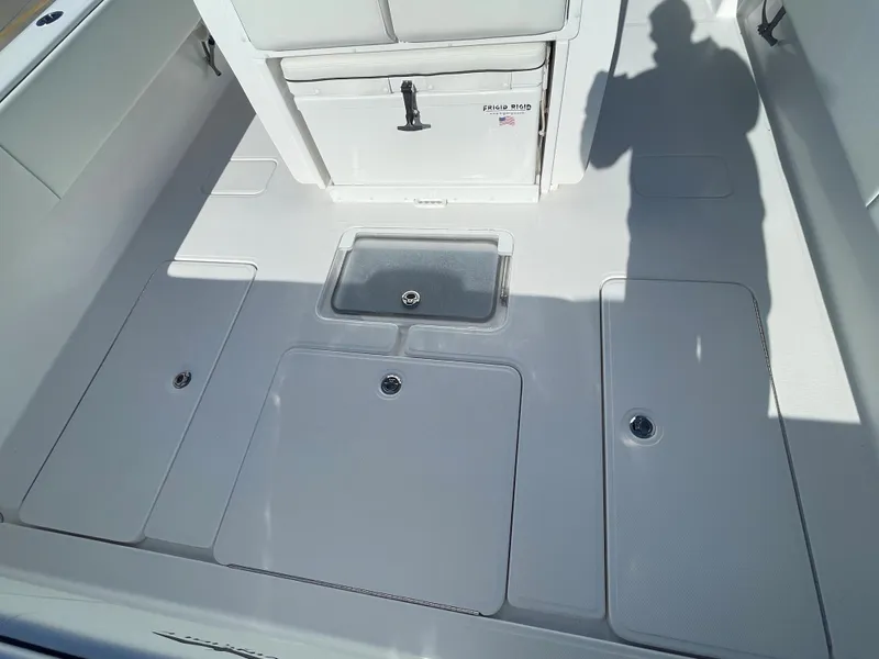 Slide: The Image of 2024 Invincible 33 Open Fisherman boat deck with storage compartments. - 9