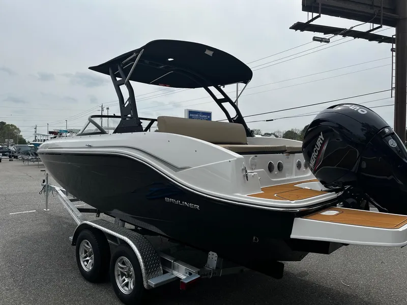 Slide: The Image of 2024 Bayliner DX2000 boat on trailer, rear view with outboard motor. - 2