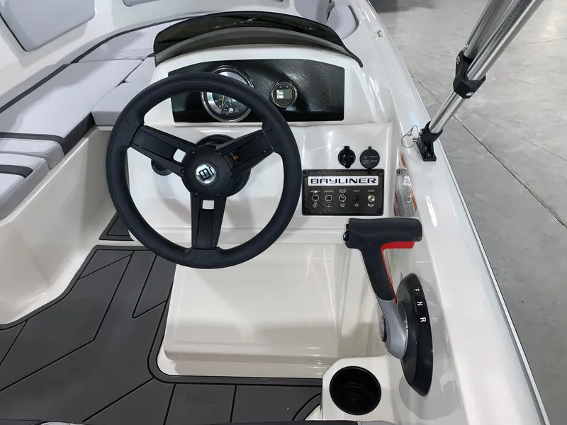 Slide: The Image of 2024 Bayliner Element M15 boat cockpit with steering wheel and control panel. - 5