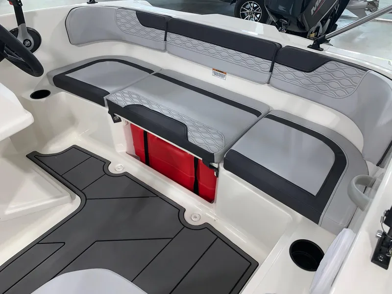 Slide: The Image of 2024 Bayliner Element M15 boat interior with gray and white seating. - 7