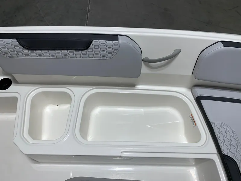 Slide: The Image of 2024 Bayliner Element M15 boat interior storage compartments and seating. - 9