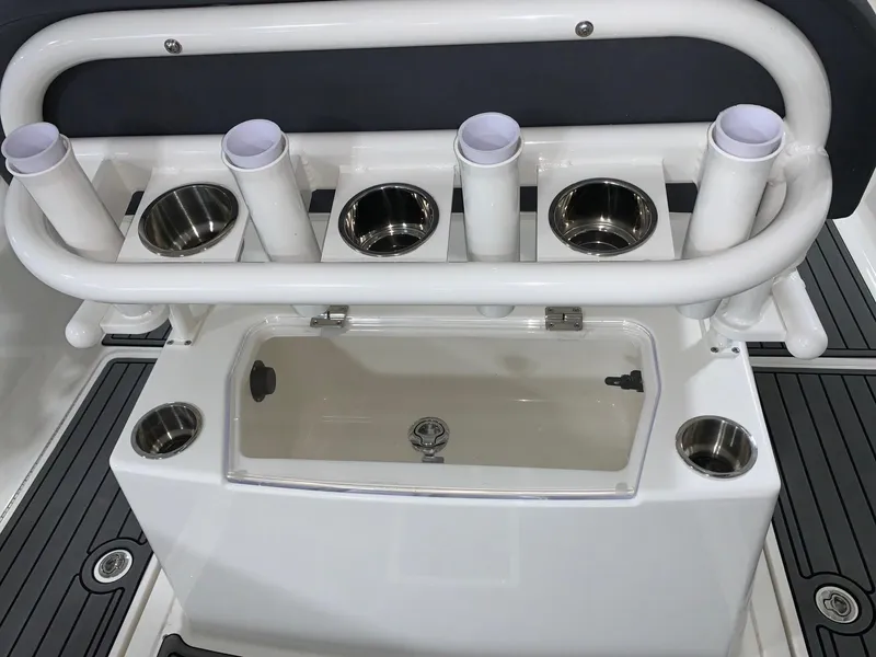 Slide: The Image of Bayliner Trophy 24 CC 2024 fishing rod holders and storage compartment. - 6